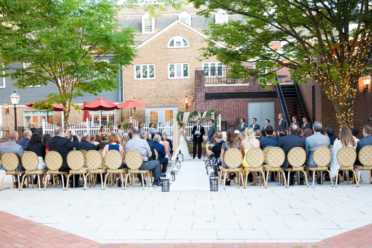 outdoor wedding ceremony on back terrace in the sunshine