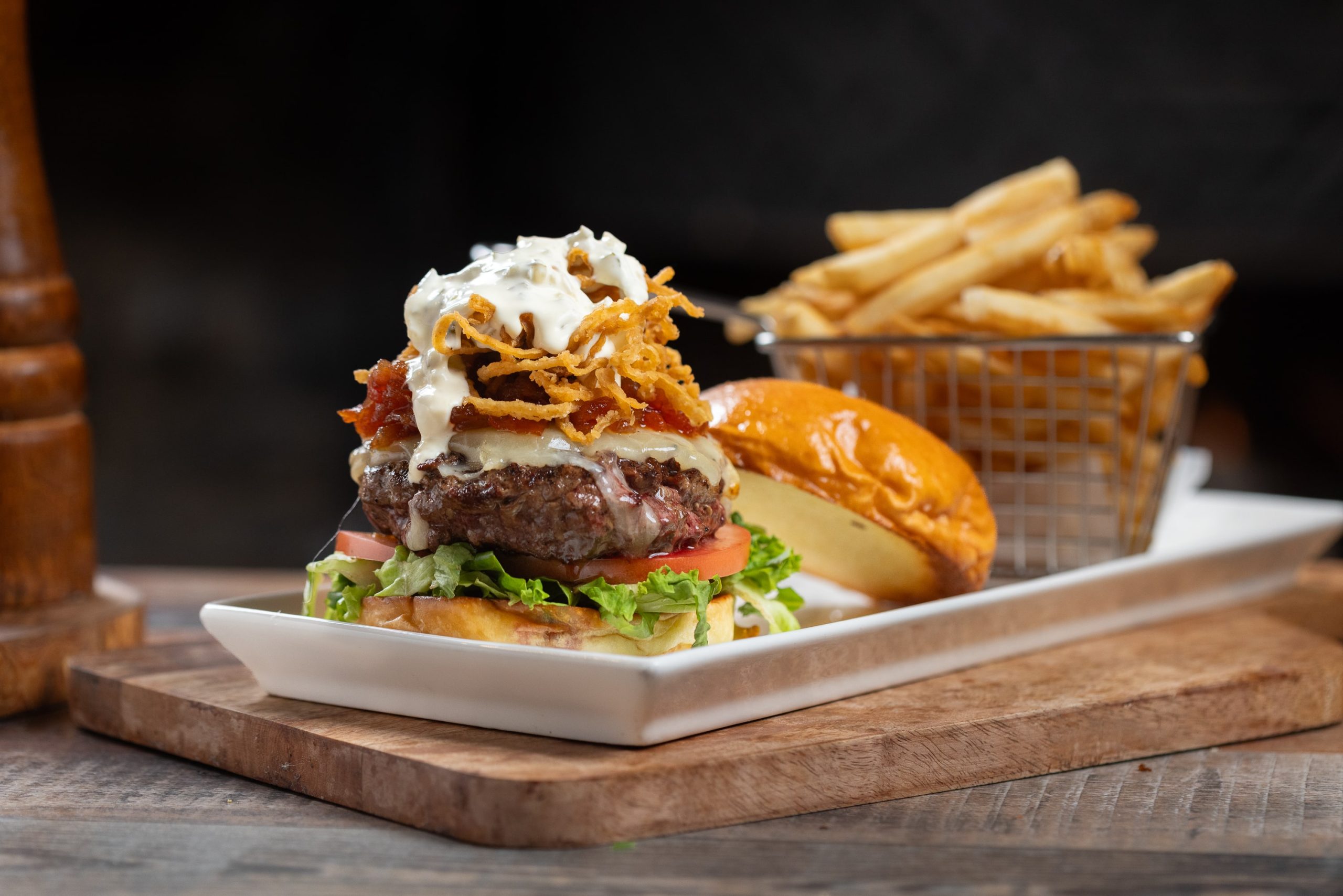 burger with fried onions and blue cheese on top