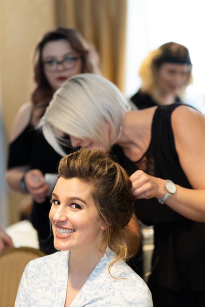 woman model smiling getting hair done