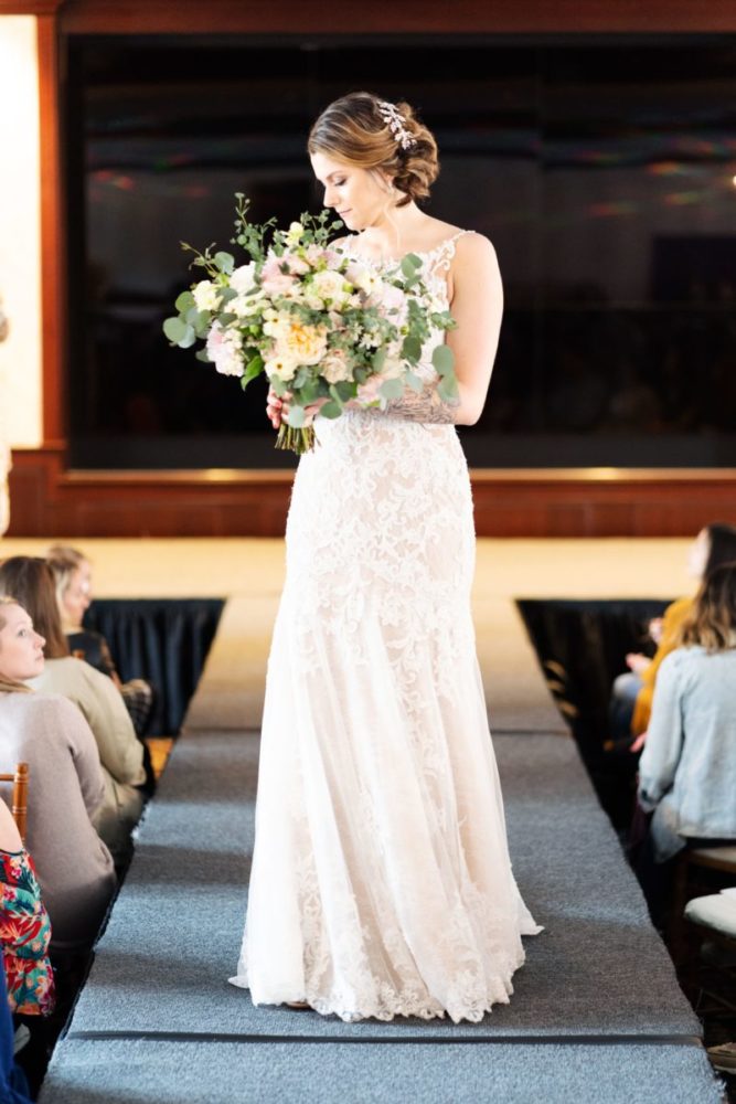 woman modeling bridal gown on runway
