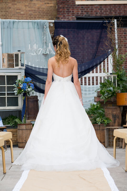 bride posing on terrace in gown