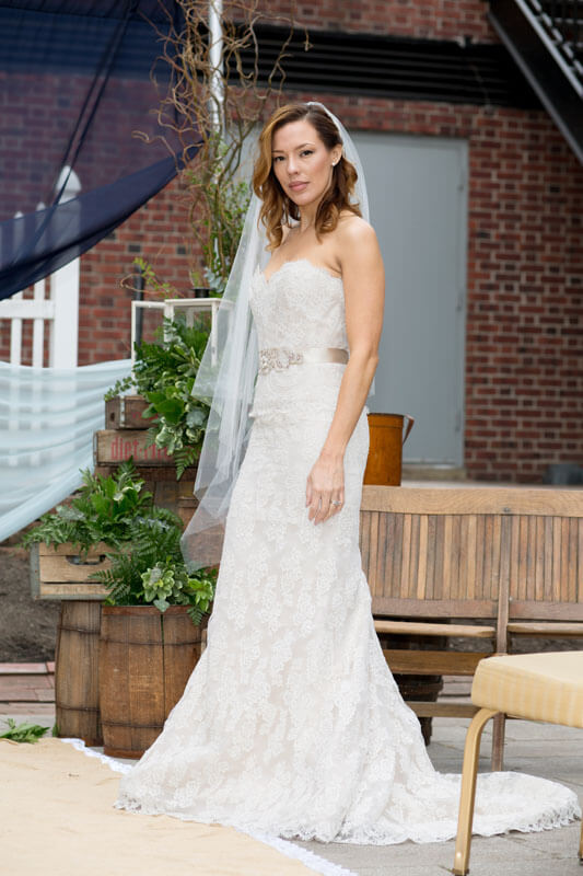 bride posing on terrace in gown