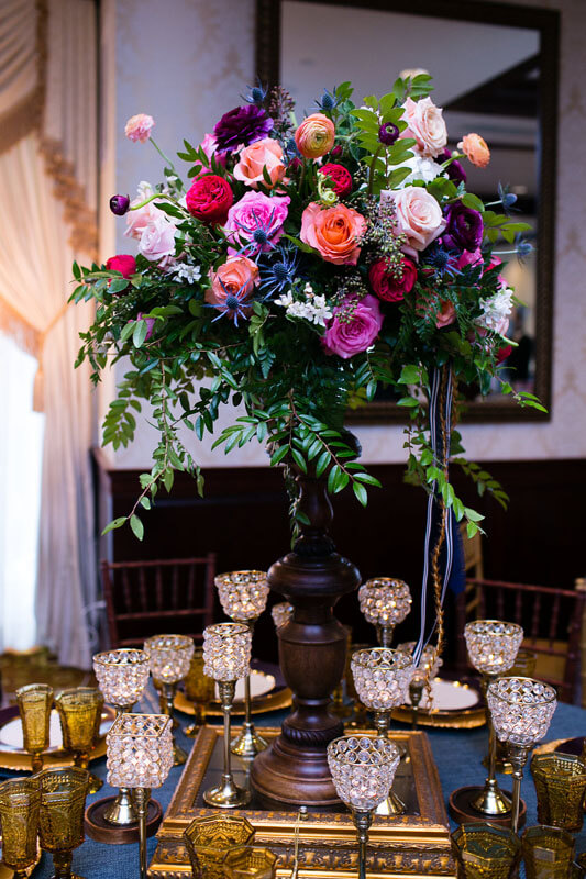 wedding table décor and tall flower centerpiece