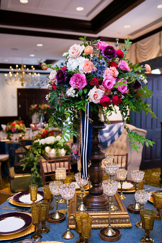 wedding table décor and tall flower centerpiece