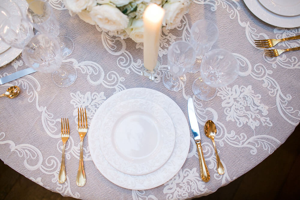 place setting with gold utensils