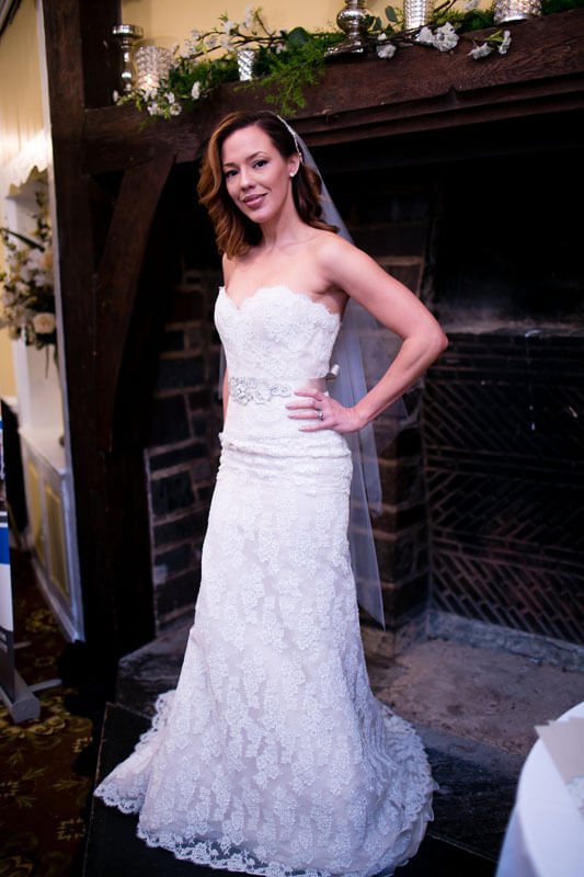 bride in front of fireplace