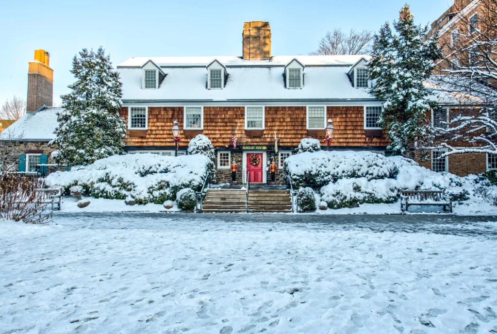 snowy exterior of nassau inn hotel red door