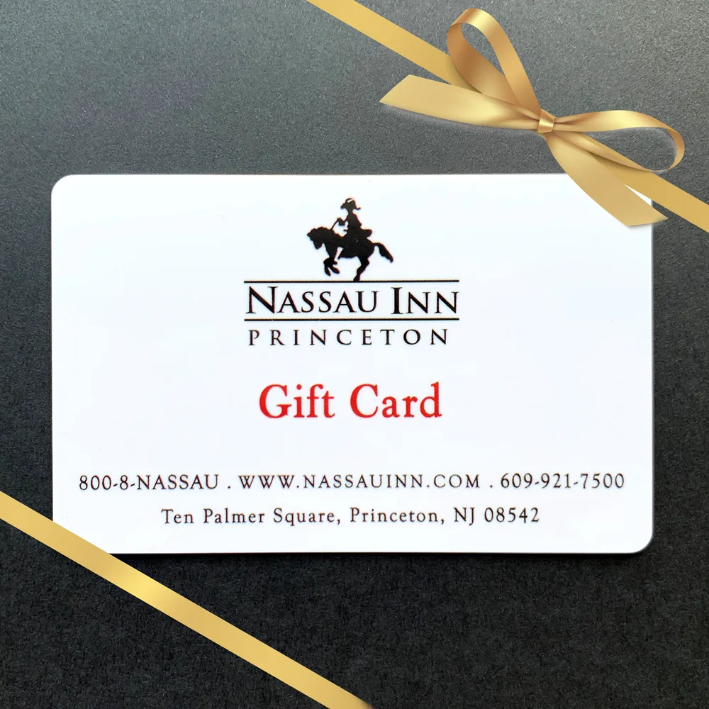 Nassau Inn gift card with gold ribbon and black background