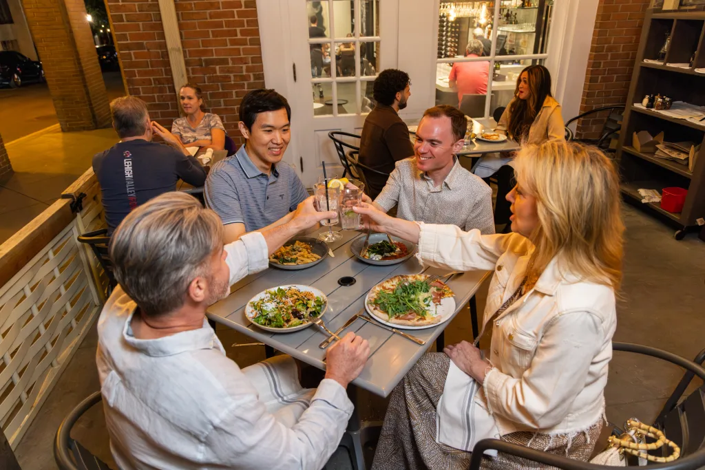 Friends dining outside at teresa caffe