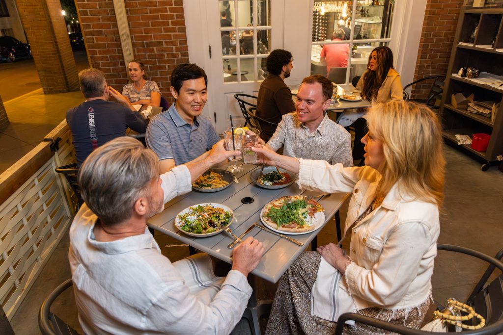Friends dining outside at teresa caffe 