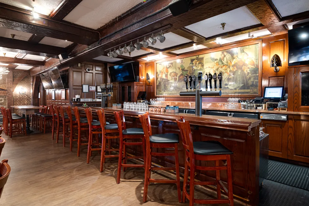 a long bar with chairs