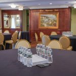 Palmer room set up with circle tables for meeting