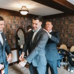 Groom getting ready in Library room