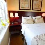 hotel room bed with small lamps