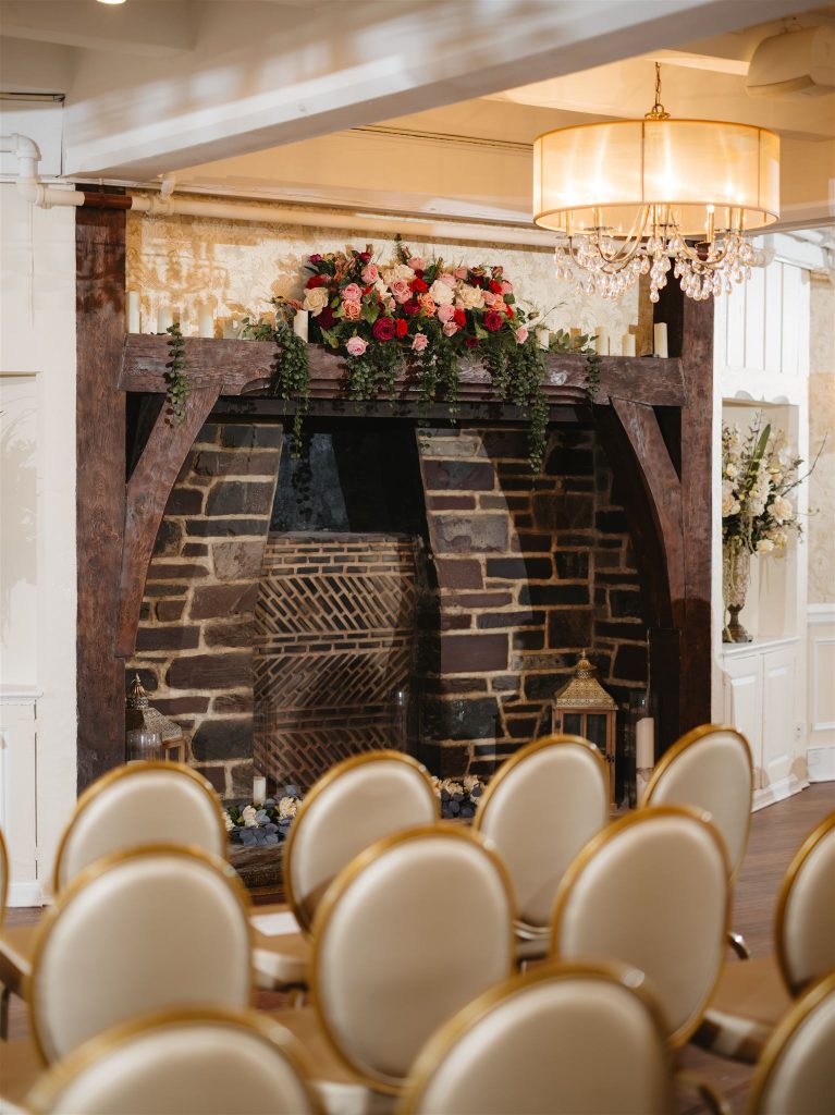 wedding chairs with a fireplace in the background