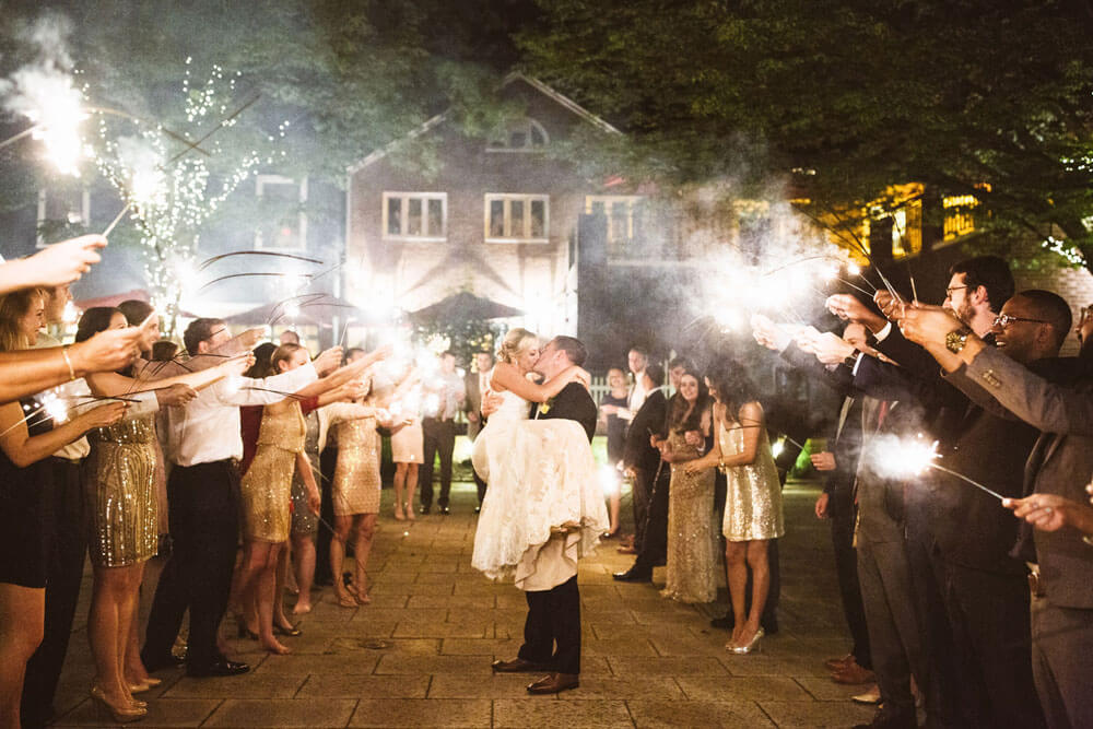 bride and groom kissing after exchanging vows outdoors at the Nassau Inn hotel in NJ.