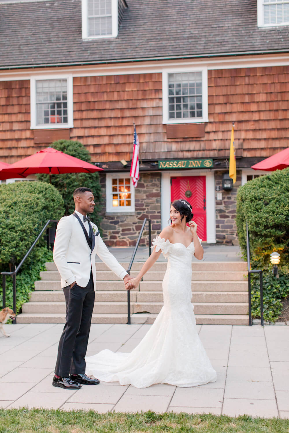 bride and groom in front of Nassau Inn door