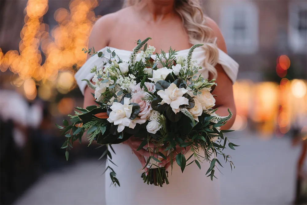 bride with a bouquet in the winter time